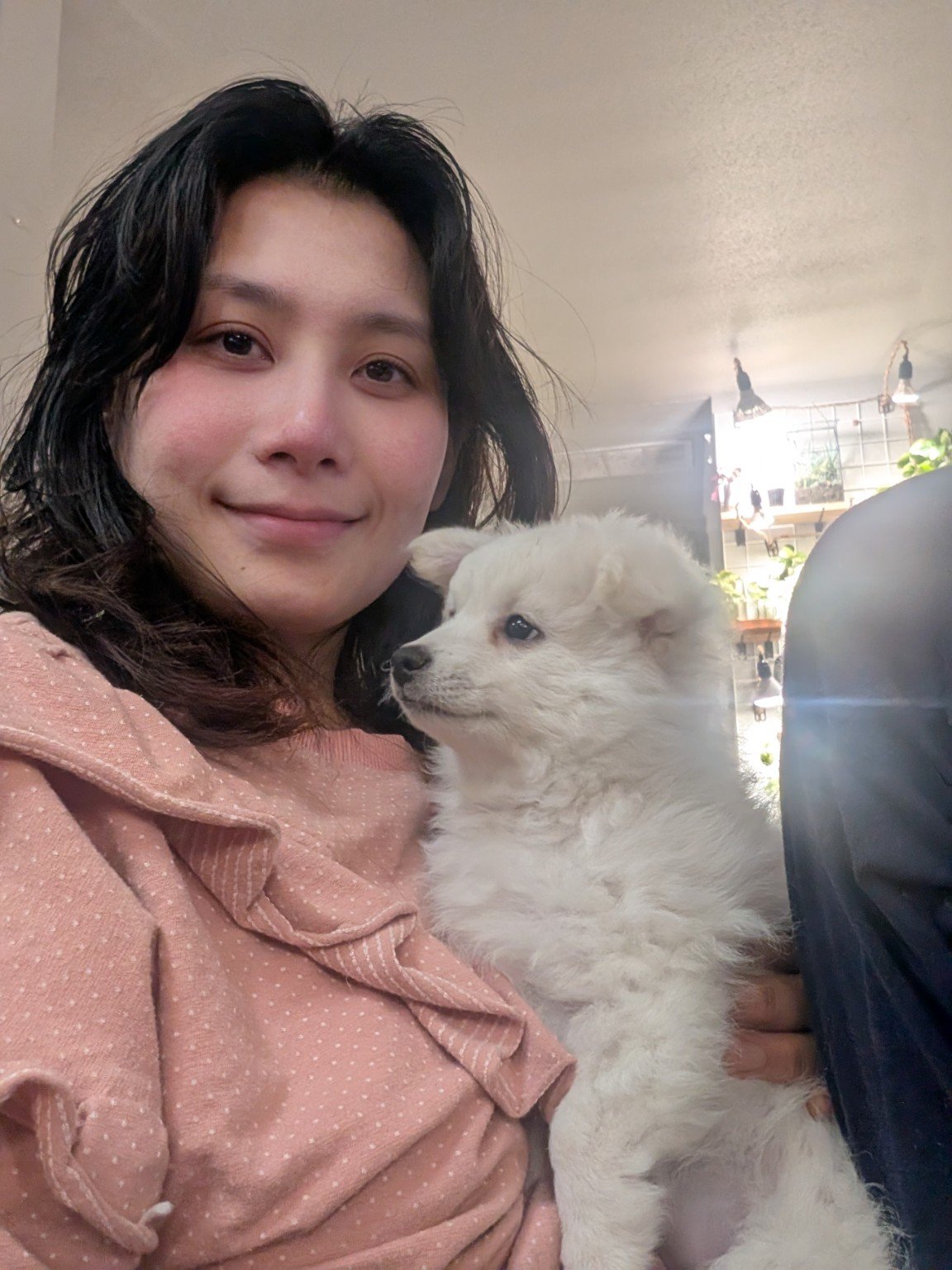 Me holding a white puppy